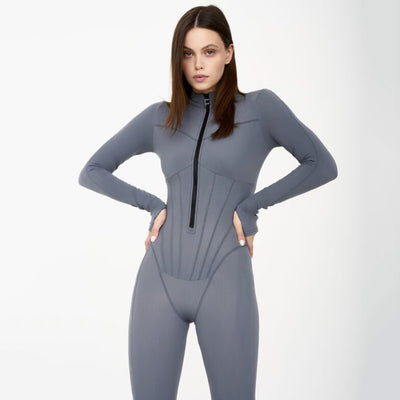 Tuta aderente da donna con maniche lunghe e zip